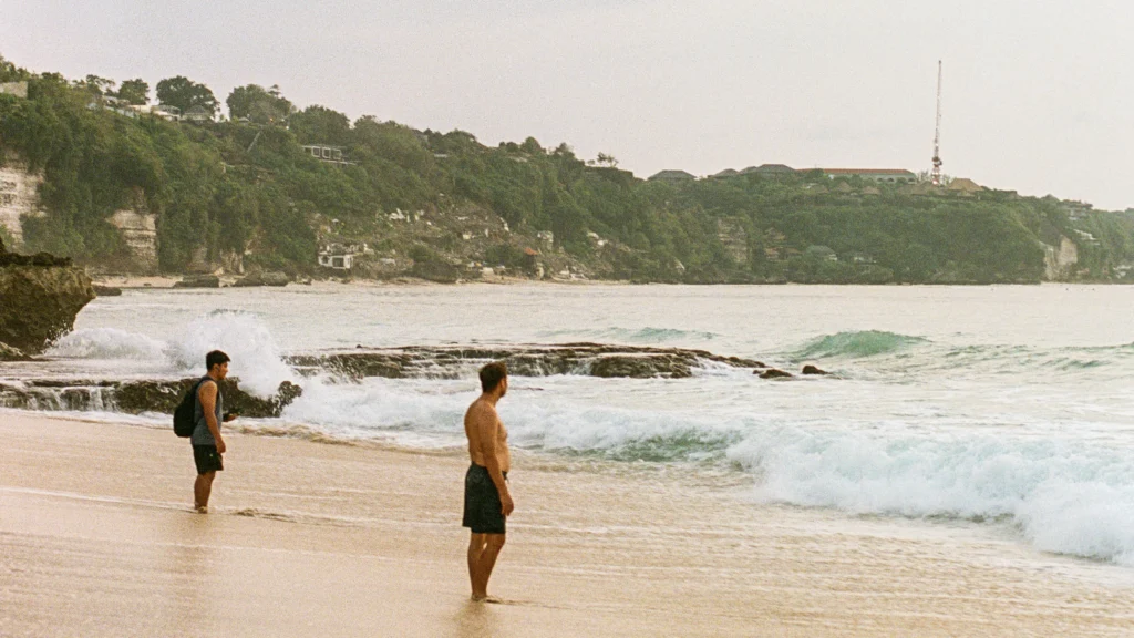 Cliff top development and the ruins of Bingin Beach seen from a distance.